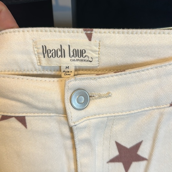 Peach Love ivory with mauve stars flare denim pants size M - Picture 2 of 3